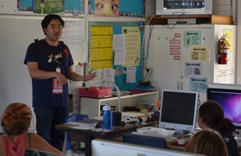 Goh Nakamura teaches a guest at Kainalu Elementary School.