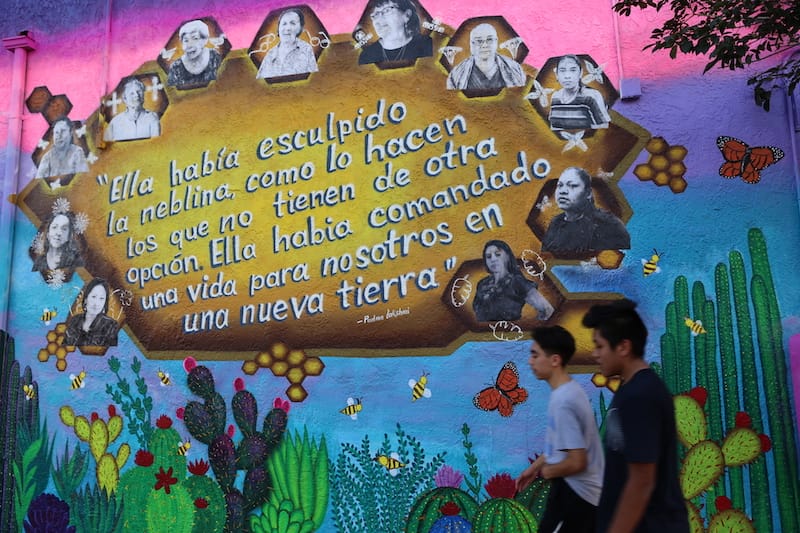 Migrant Mamas mixed-media mural, featuring their portraits of inspirational migrant women