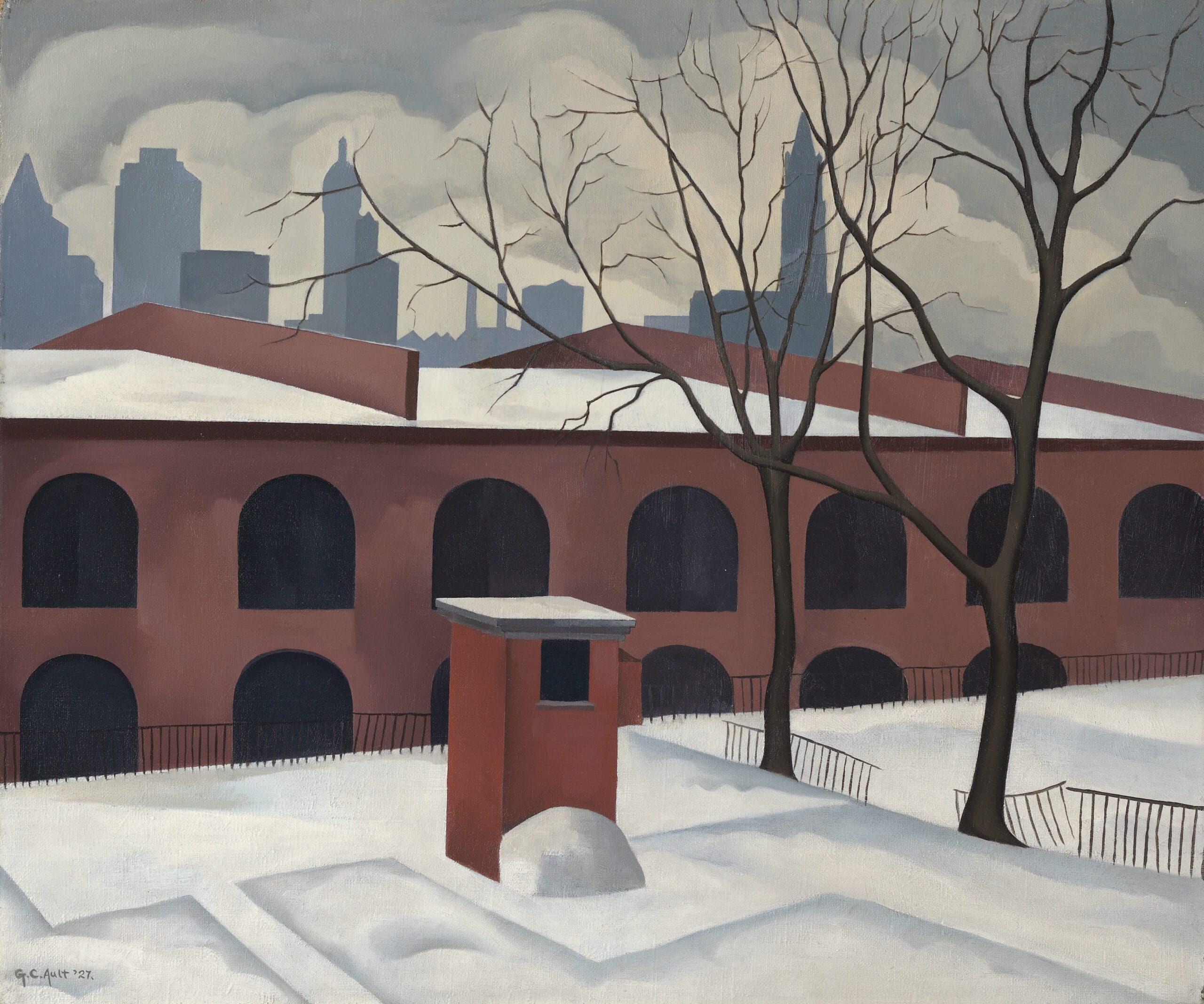 Snowy landscape in front of a wide brick building with rows of black arched windows, with the New York skyline in silhouette against a cloudy sky.