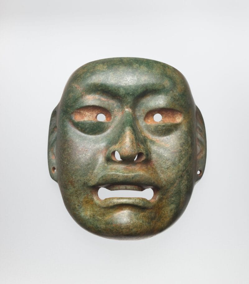 Naturalistic face mask with open mouth, large eyes, and ear spools.