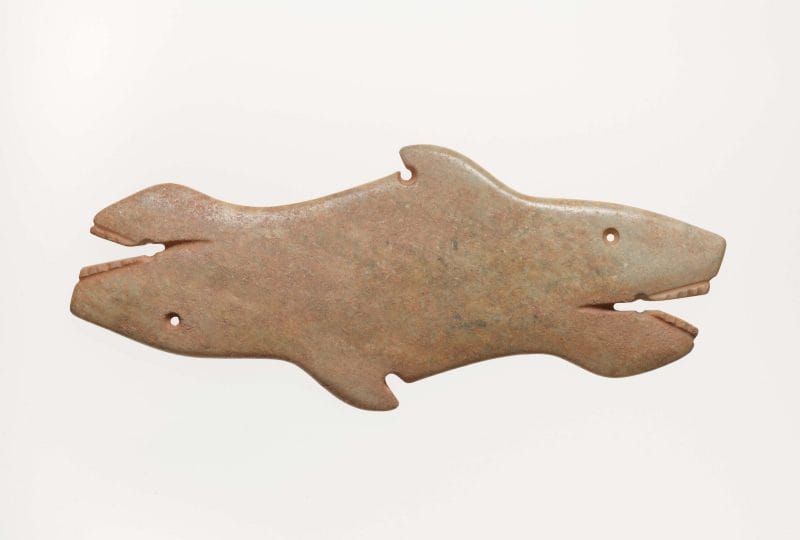 Flat pendant with fish heads on each end.