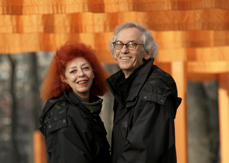Christo and Jeanne-Claude stand in front of their work of art 