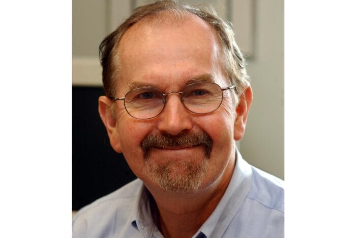 A photo of Richard Flavell in a blue dress shirt.