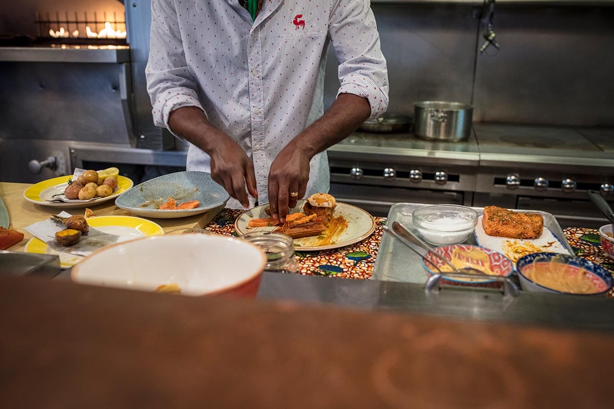 Chef Marcus Samuelsson in the kitchen at Red Rooster in New York City