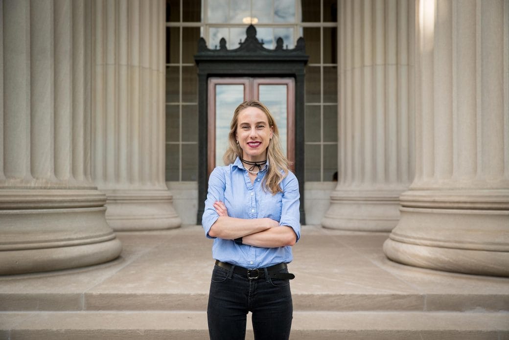 Polina Anikeeva standing outside a building on the MIT campus.