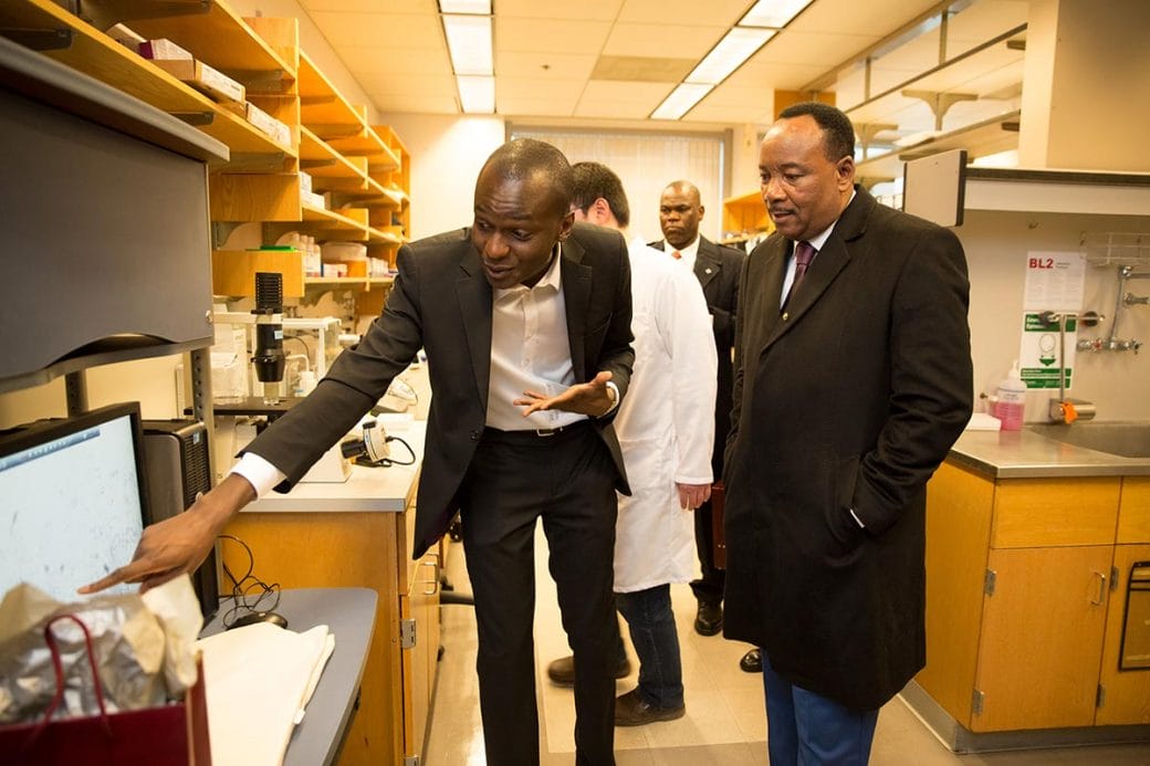 Ibrahim in his lab at MIT with Niger’s President Mahamadou Issoufou.