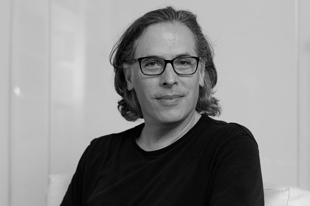 Black and white portrait of Rodrigo Prieto wearing a black shirt.