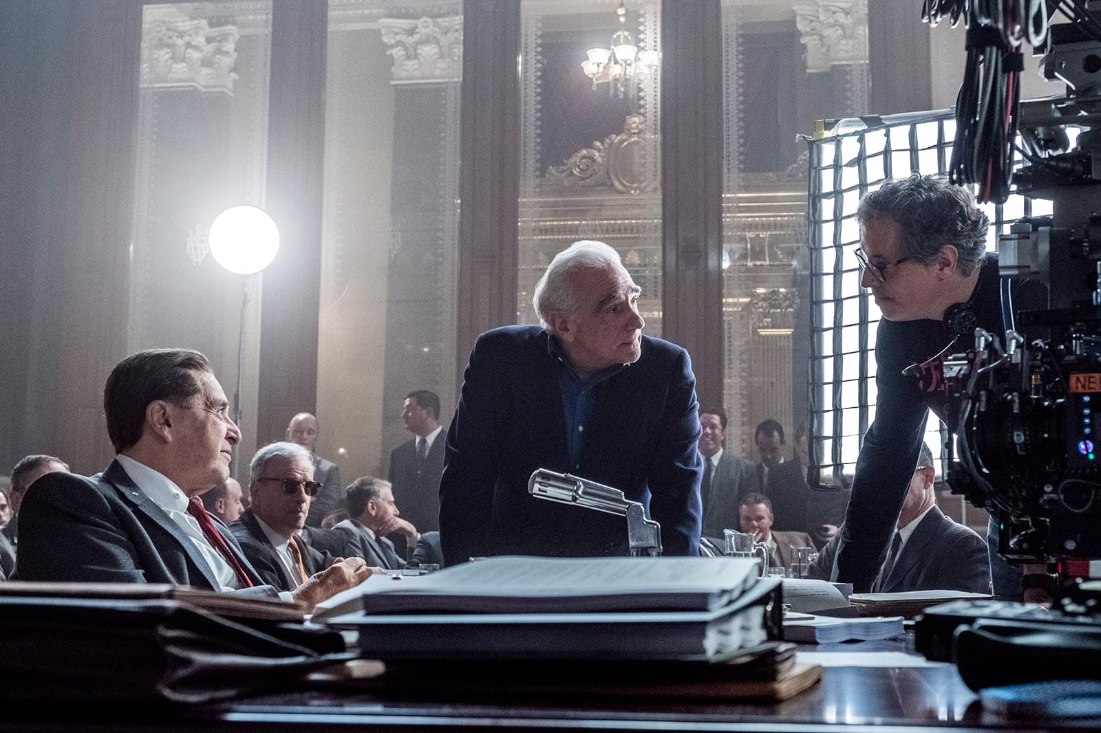 Rodrigo Prieto and Martin Scorsese leaning over a table discussing the filming of The Irishman.