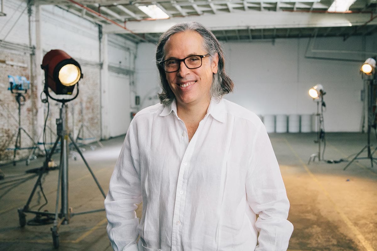 Rodrigo Prieto standing in front of film production lights.