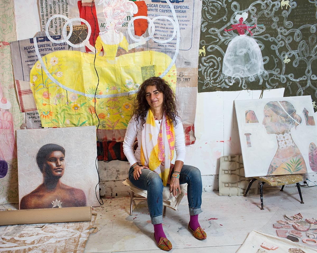 Michela Martello in her studio, surrounded by her artwork.