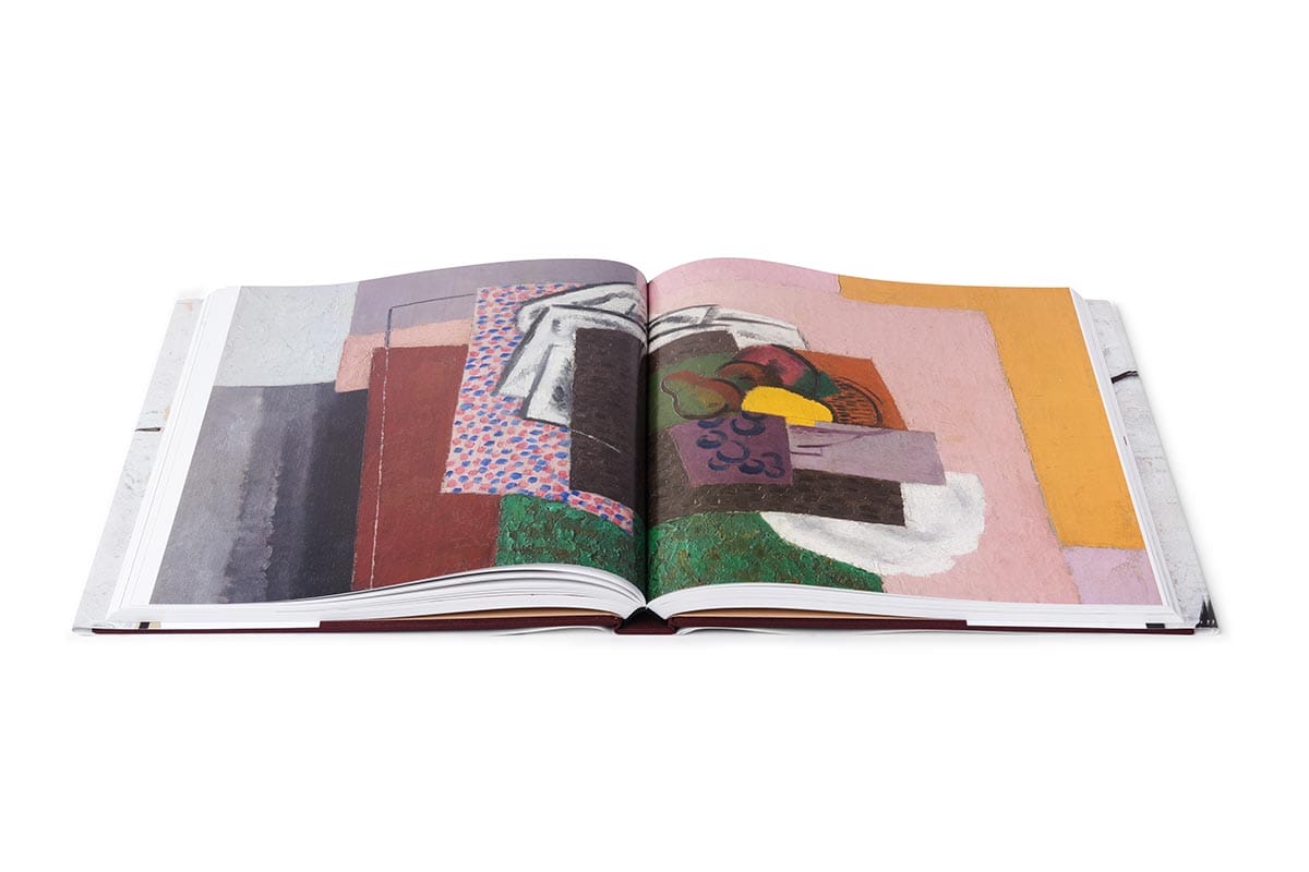 Interior view of the Masterpiece of American Modernism book open to a full page spread of artwork.