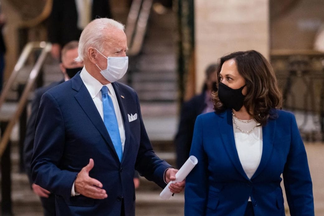 President Joseph Biden and Vice President Kamala Harris walking and speaking.