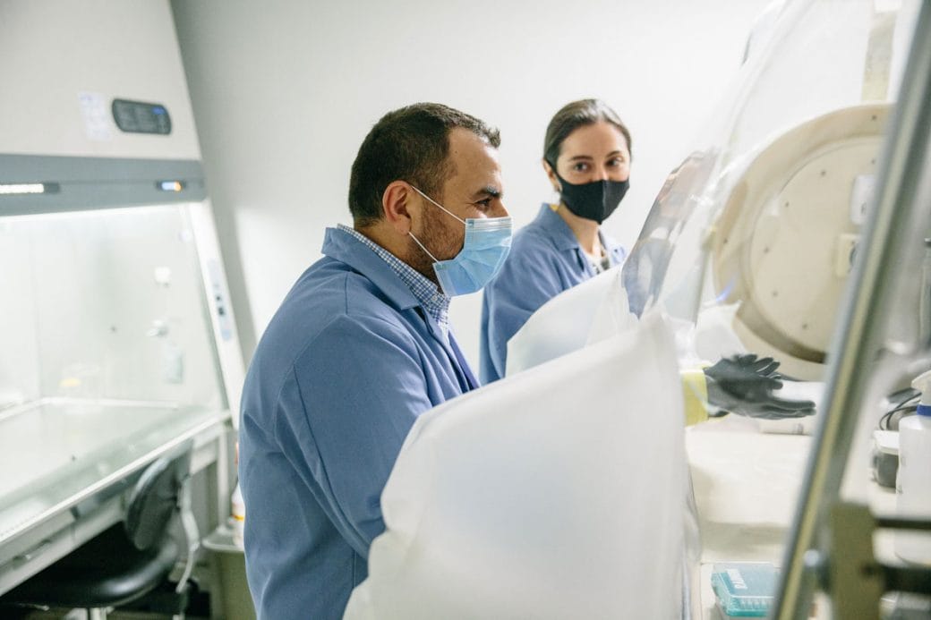 Mohamed Abou Donia and a colleague test a sample in the lab.