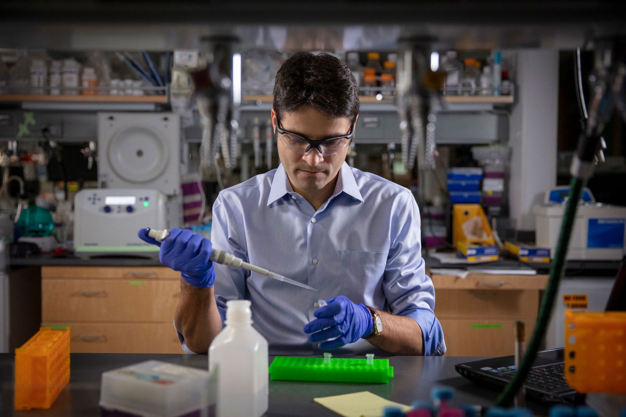 Scientist Mikhail G. Shapiro using a pipette in his lab.
