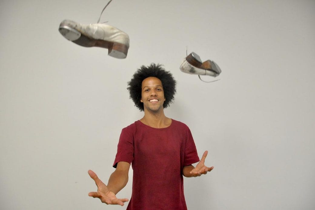 Leonardo Sandoval tosses tap dance shoes in the air.