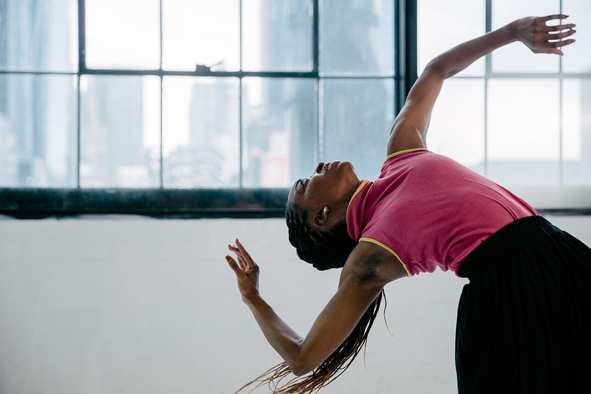 Tamisha Guy dancing in a studio.