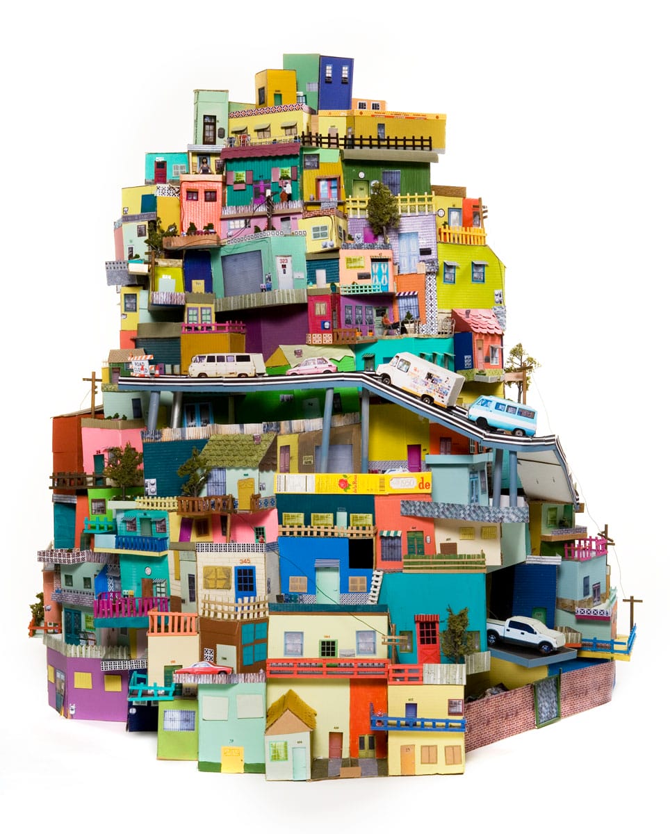 A sculpture of colorful houses on a hillside.