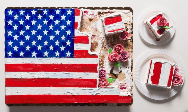 Cake with an American flag and roses.