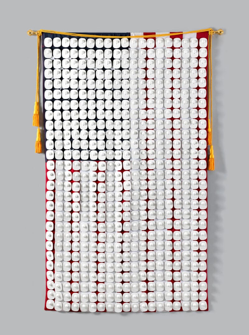 American flag with security tags attached.