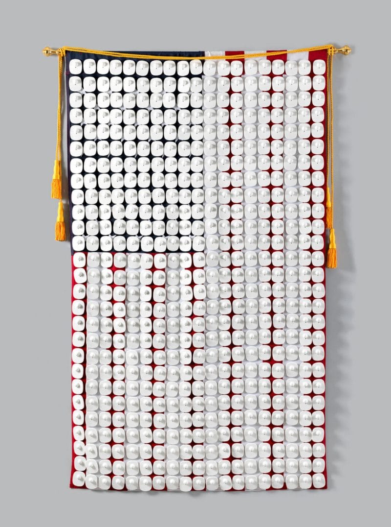 American flag with security tags attached.