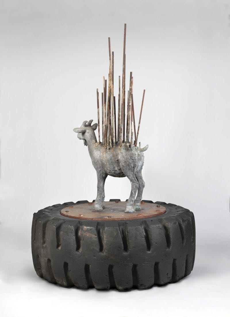 Rebar rises from the back of this goat's sculpture.