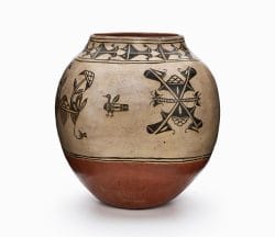 A three-color Cochiti polychrome olla features white slip with black and red painted decoration.
