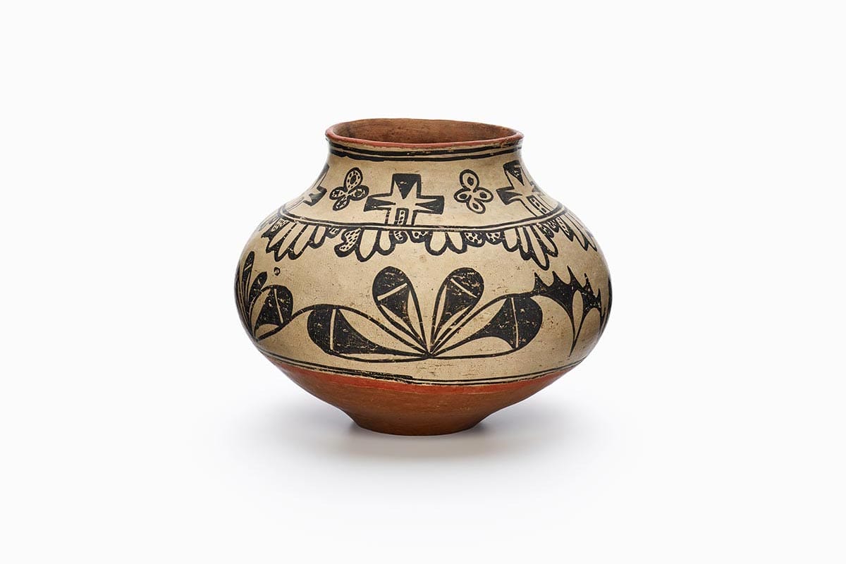 A Tesuque jar with black designs.