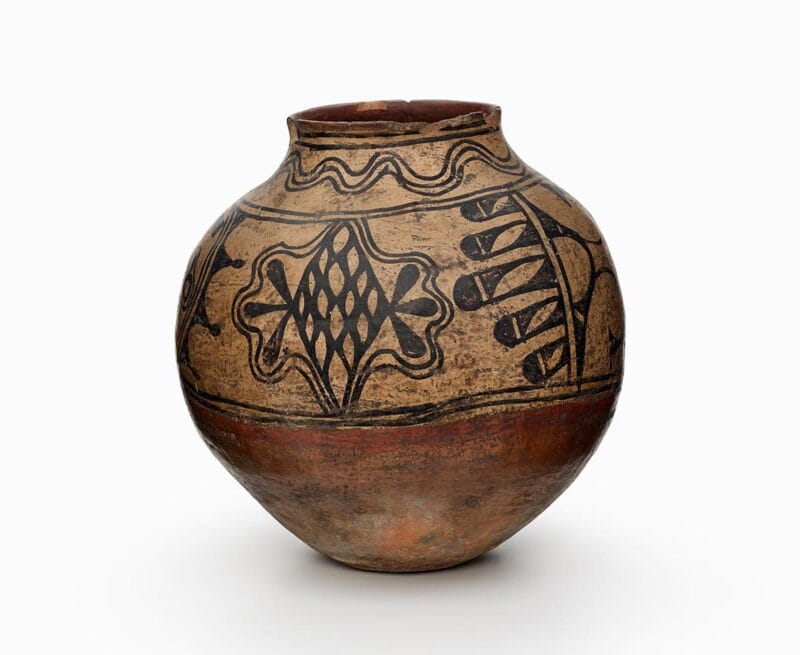 A Powhogeh storage jar with black and red painted decoration.