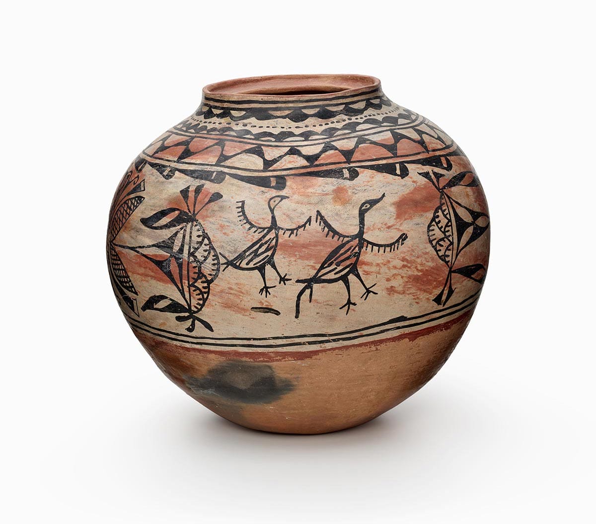 A Tesuque jar with stylized bird designs.