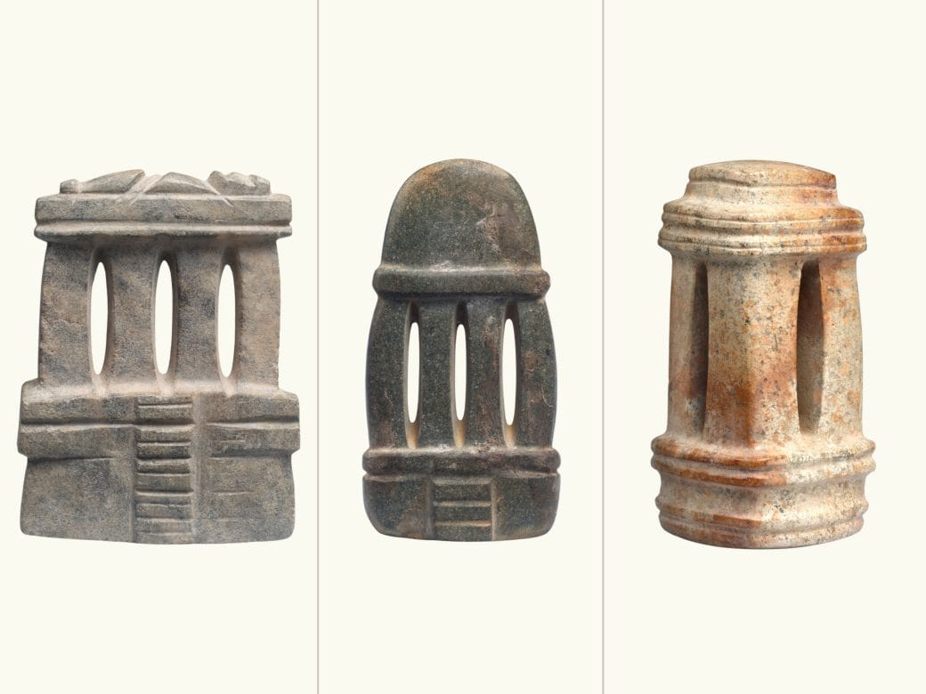 A comparison of 3 objects: 1. a flat green-grey 4 column temple in with figure on the top, 2. a flat mottled-stone 4 column temple with round top, and 3. a mottled stone temple with 3 dimensional shape. 