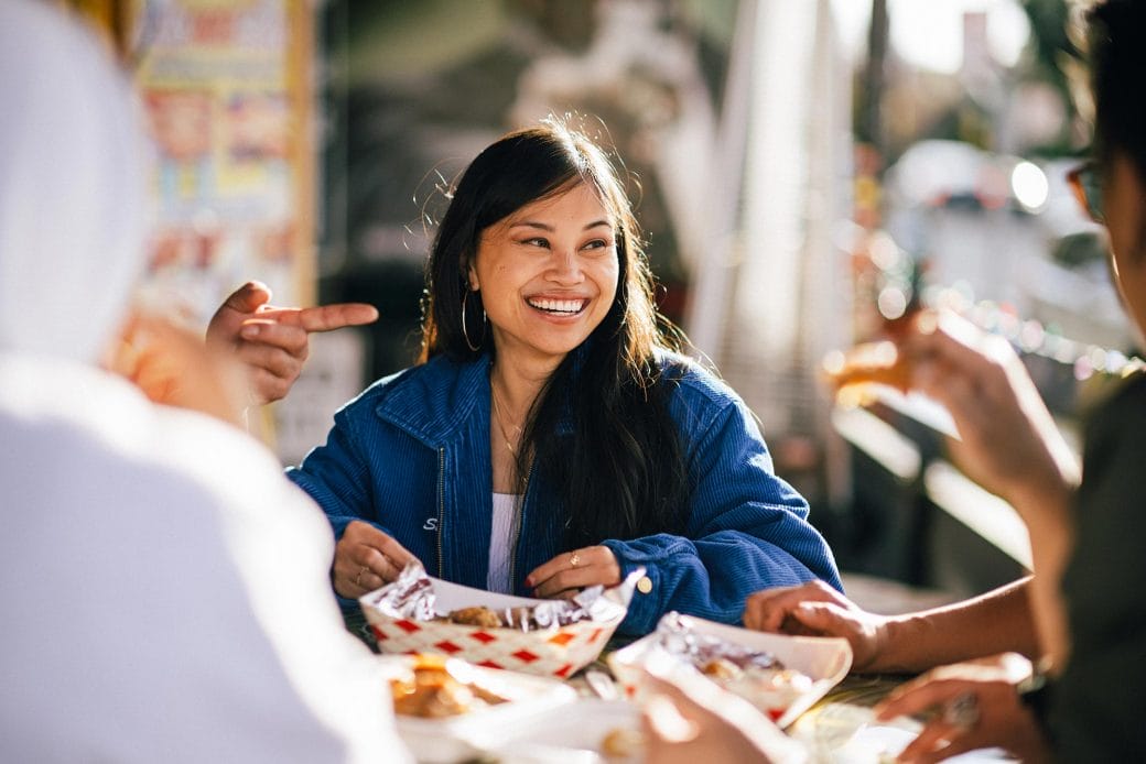 Ruby Ibarra smiles as she eats at a restaurant with her collaborators.