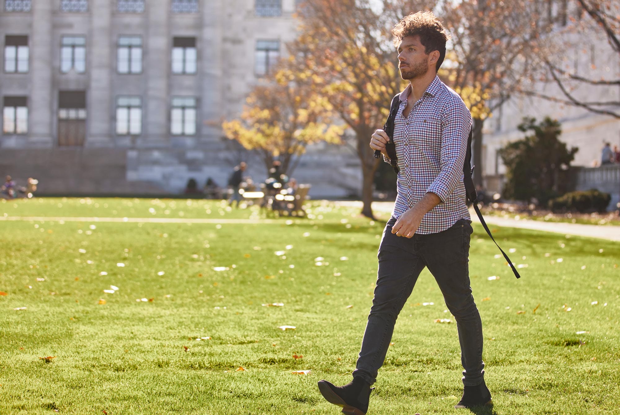 Edward Chouchani walks across the campus of Harvard Medical School.