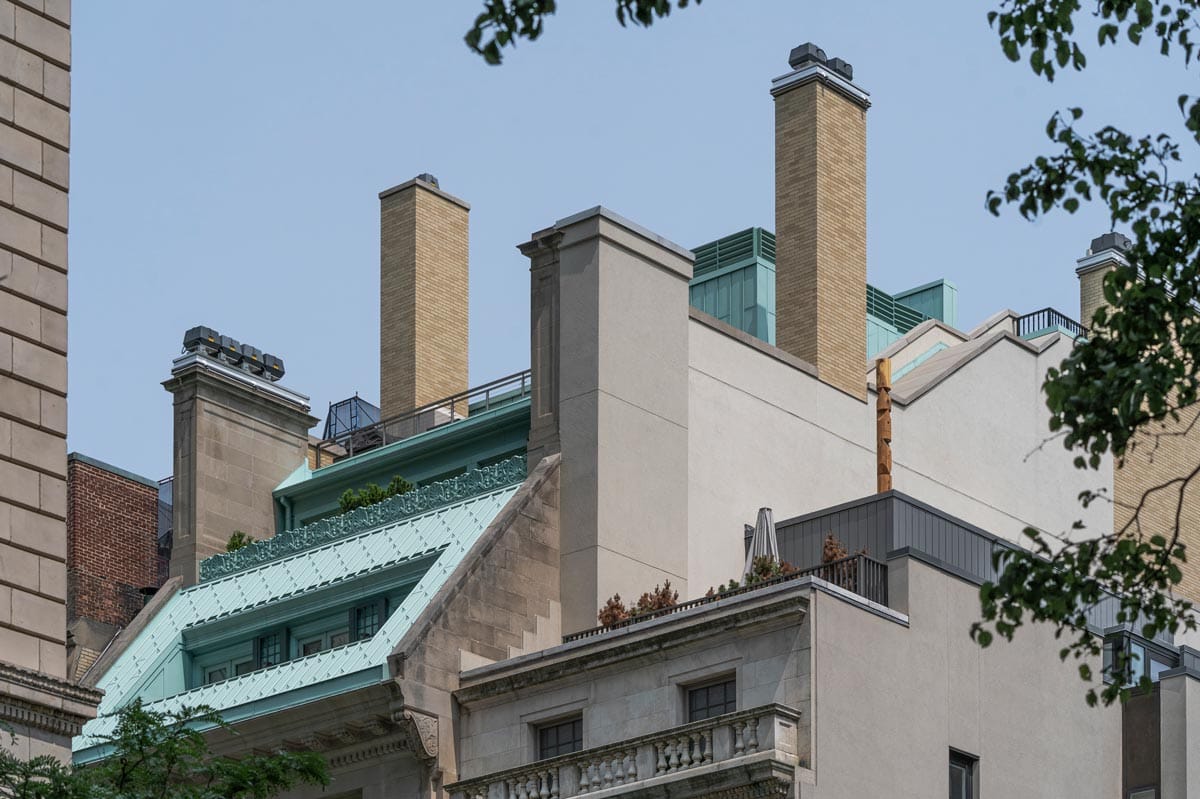 The birdhouse on the rooftop as seen from a distance.