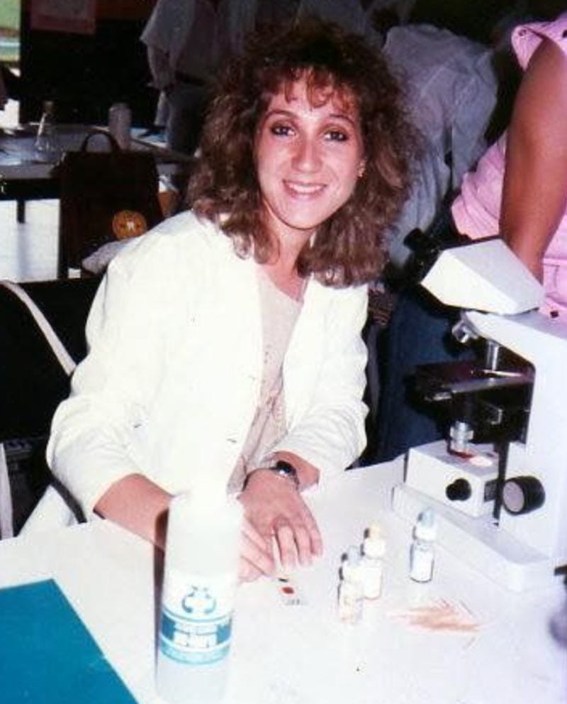 A young Dr. Maria Elena Bottazzi running an experiment in a lab. 