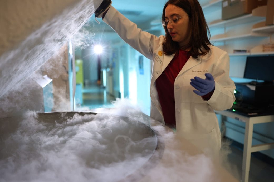 Gerta Hoxhaj uses a dry ice machine to conduct an experiment in her lab.