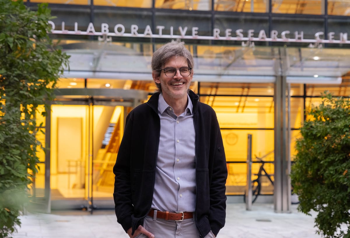 Luciano Marraffini standing outside the entrance to the research labs at Rockefeller University.