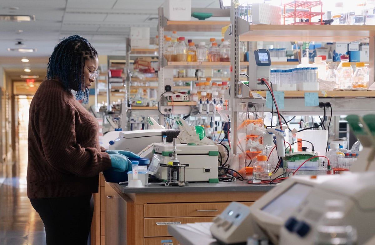 A colleague of Luciano Marraffini's working with equipment in his lab.