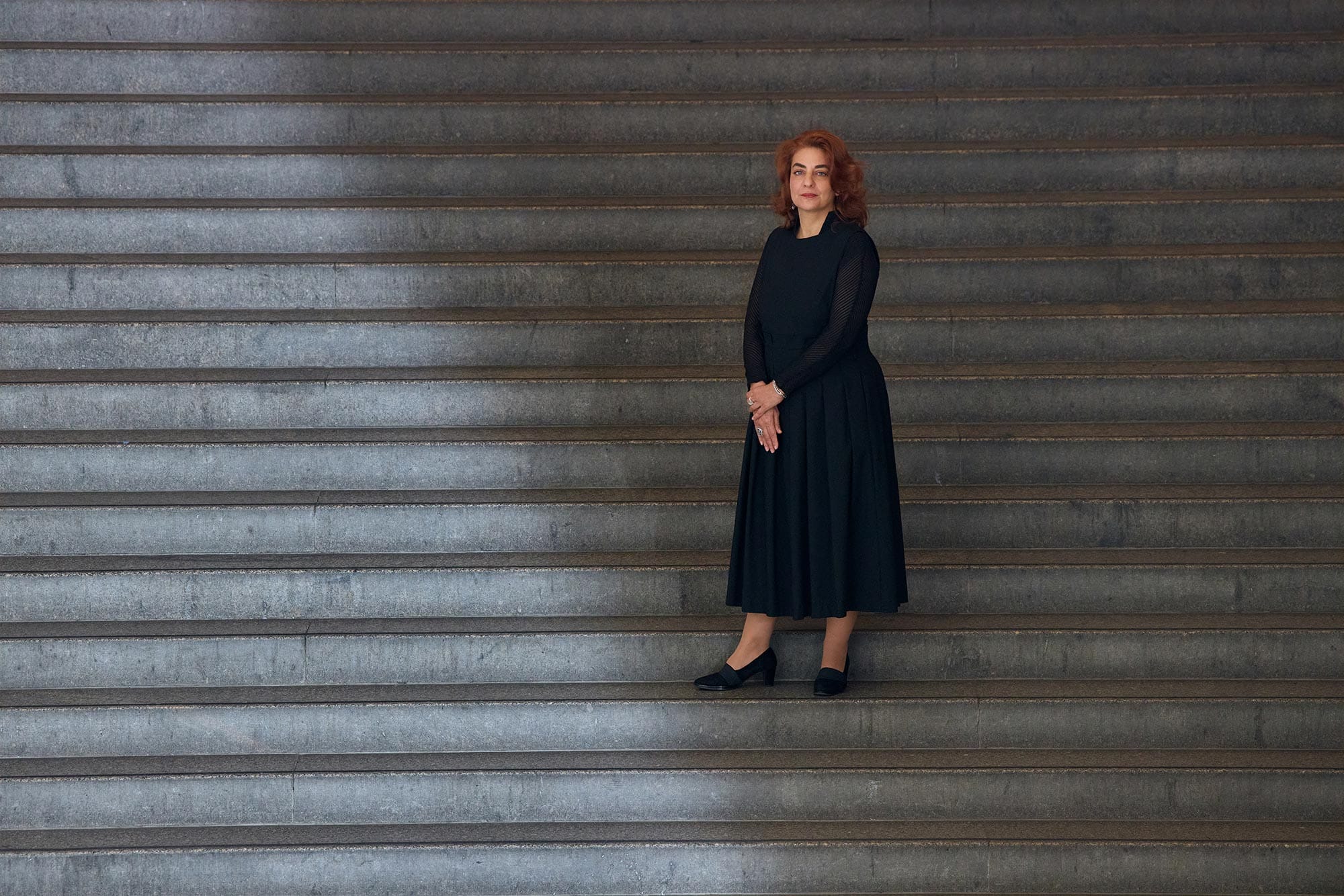 Monika Bincsik standing on grand staircase.
