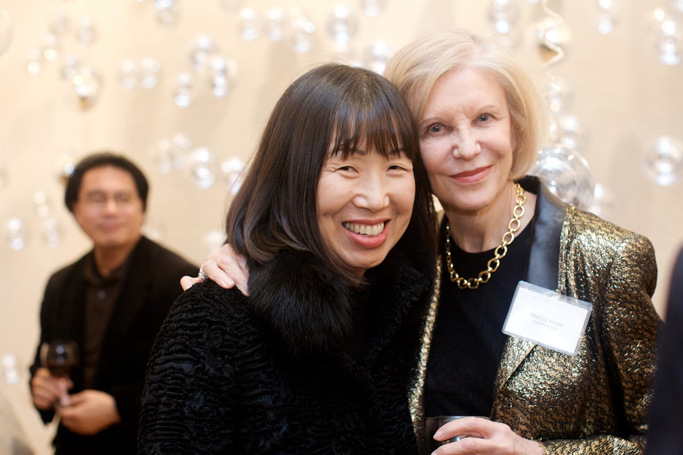 Jung Lee Sanders smiling with Marica Vilcek.