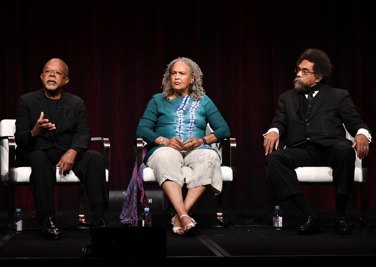 Henry Louis Gates Jr., Charlayne Hunter-Gault and Dr. Cornel West sitting side-by-side answering questions on a panel.