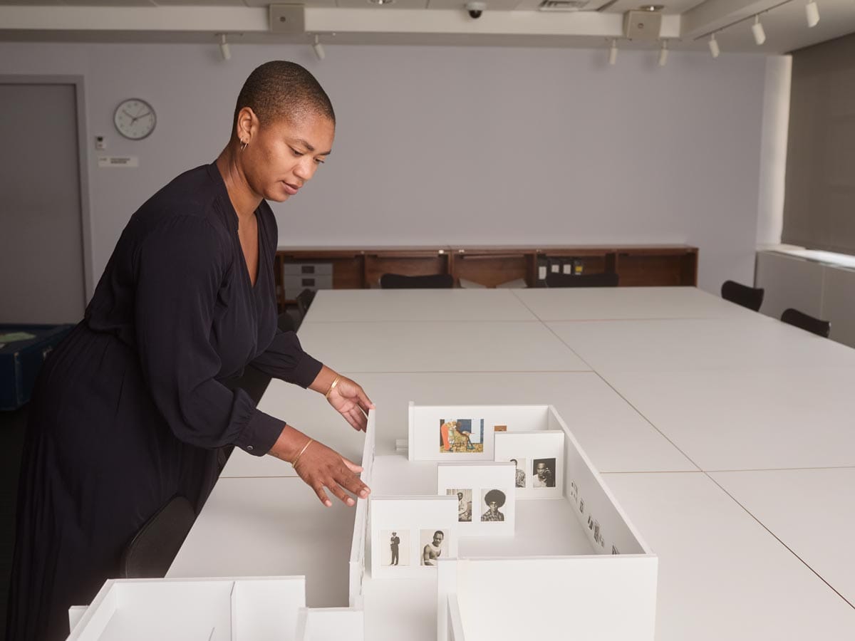 Oluremi working with an exhibition model.