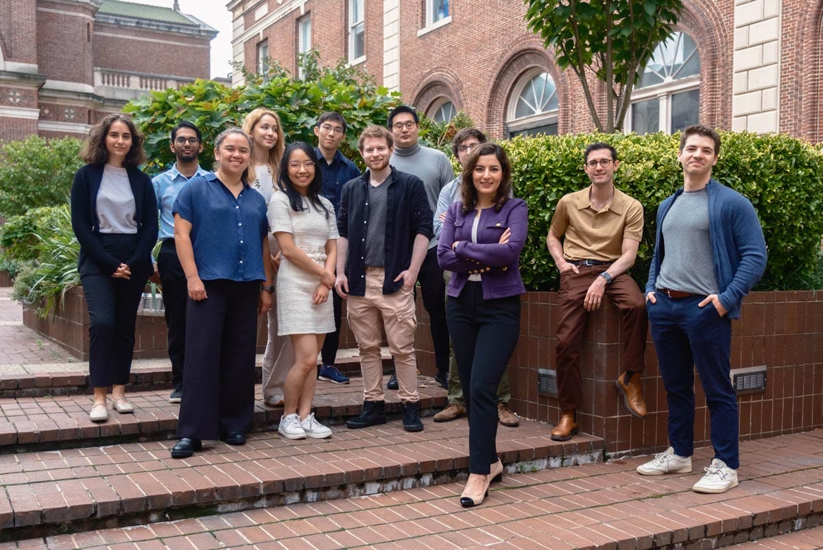 Elham pictured with eleven of her lab members on the Columbia University campus.