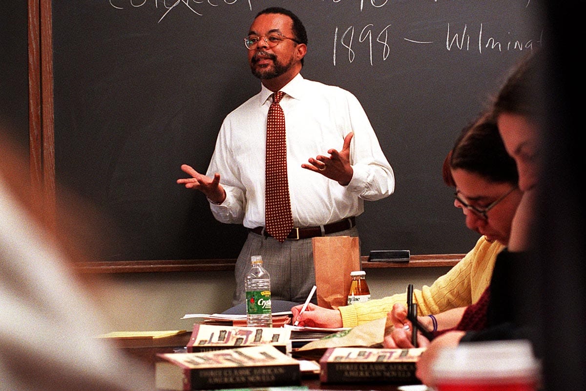 Henry Louis Gates, Jr. teaching a class in front of a chalkboard in 1996.